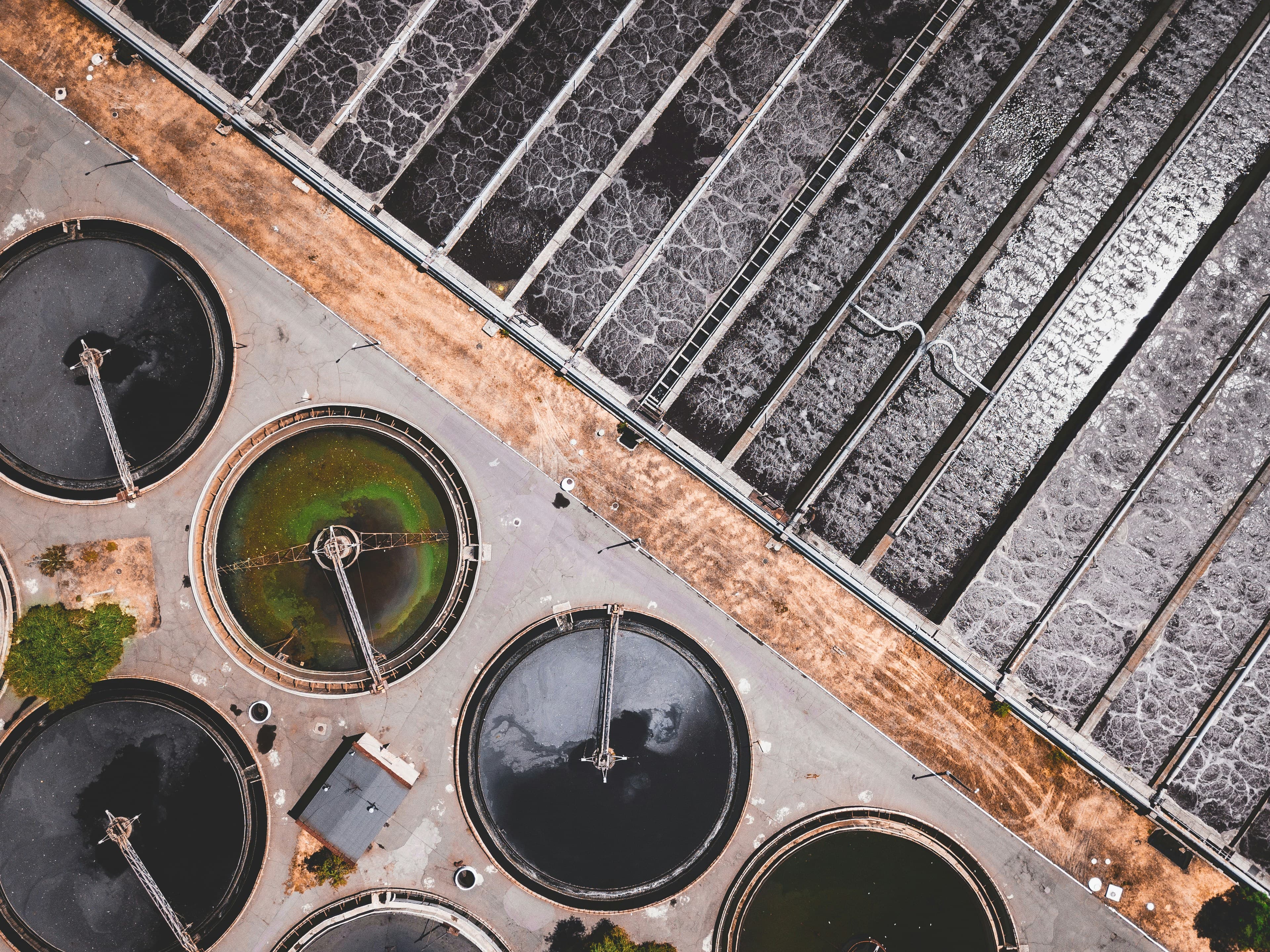 Aerial view of wastewater treatment basins and clarifiers